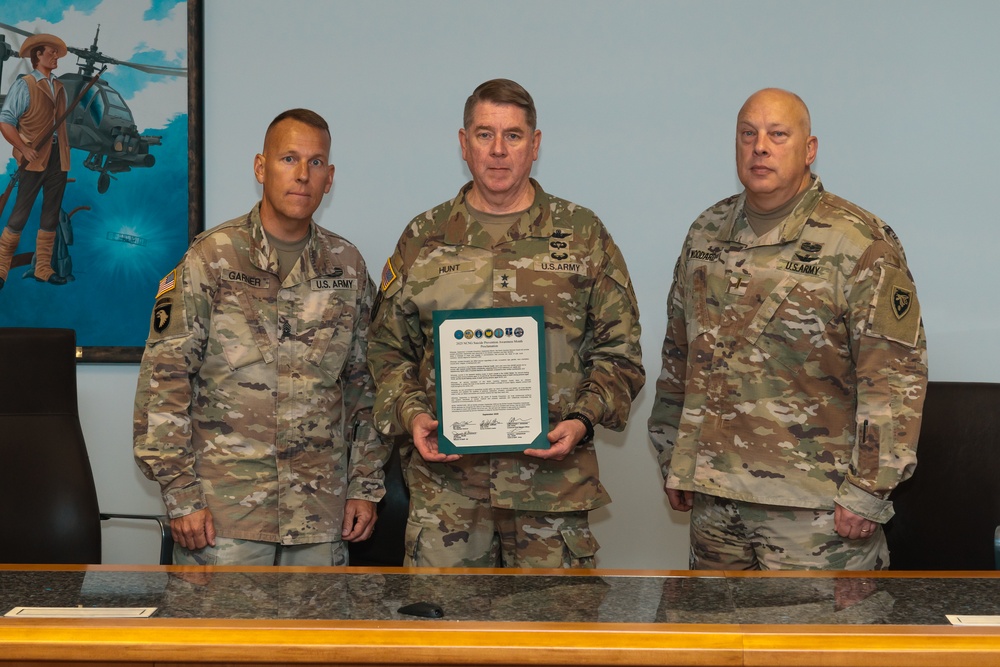 Maj. Gen Todd Hunt signs the Suicide Prevention Awareness Proclamation