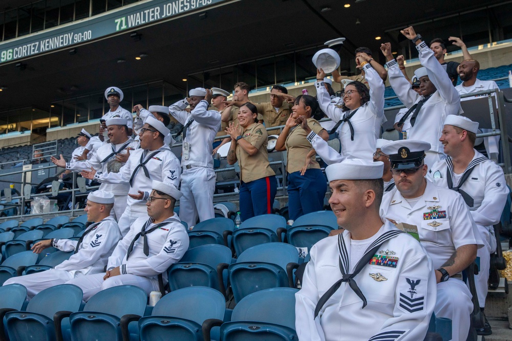 Sailors and Marines attend the Seattle Seahawks Fest