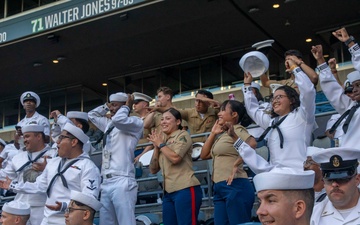 Sailors and Marines attend the Seattle Seahawks Fest