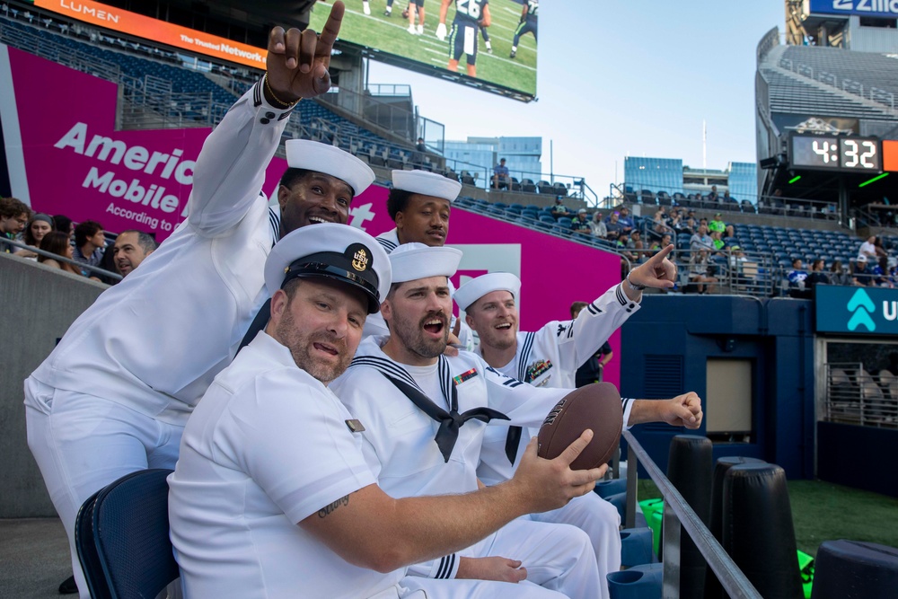 Sailors and Marines attend the Seattle Seahawks Fest