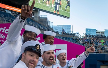 Sailors and Marines attend the Seattle Seahawks Fest