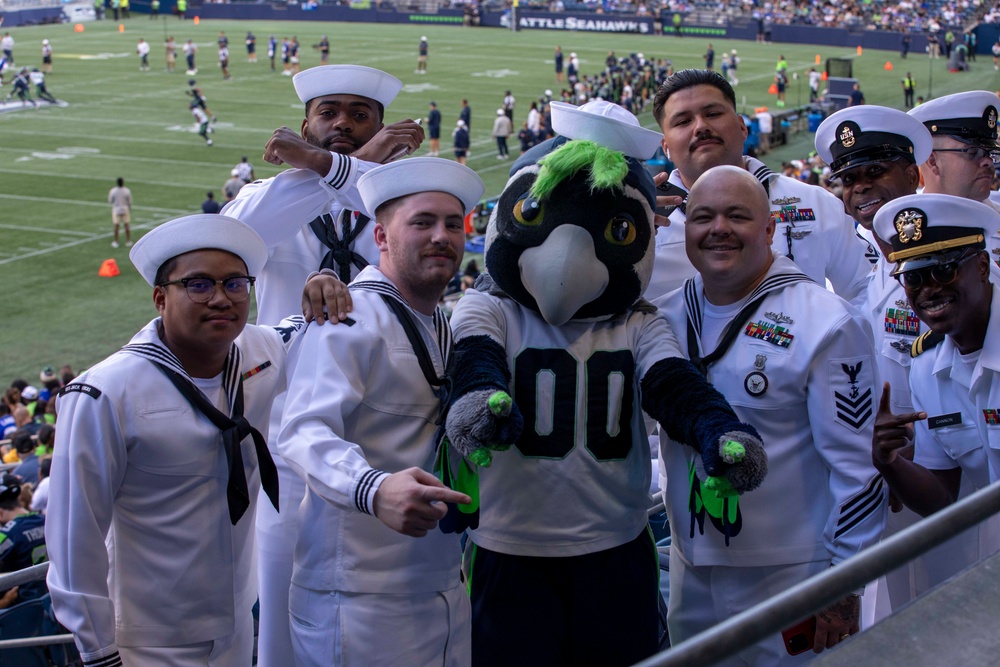 Sailors and Marines attend the Seattle Seahawks Fest