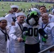 Sailors and Marines attend the Seattle Seahawks Fest