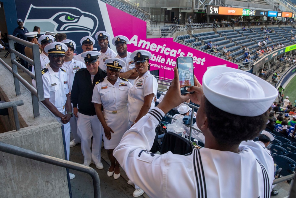 Sailors and Marines attend the Seattle Seahawks Fest