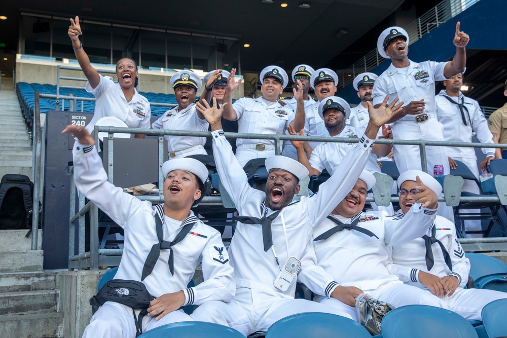 Sailors and Marines attend the Seattle Seahawks Fest