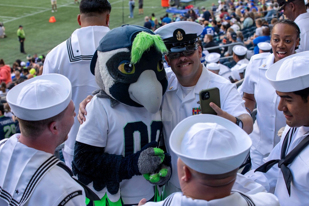 Sailors and Marines attend the Seattle Seahawks Fest