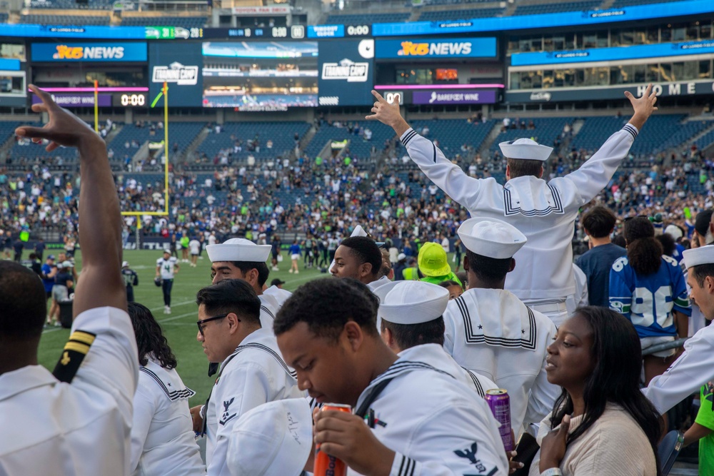 Sailors and Marines attend the Seattle Seahawks Fest