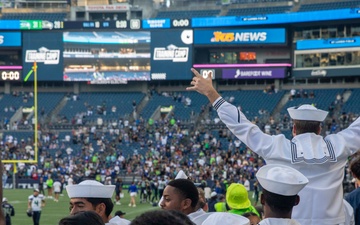 Sailors and Marines attend the Seattle Seahawks Fest