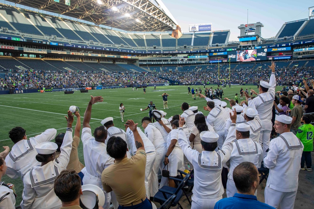 Sailors and Marines attend the Seattle Seahawks Fest