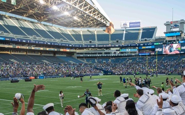 Sailors and Marines attend the Seattle Seahawks Fest