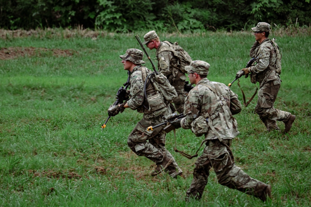 Soldiers with 2nd Battalion, 23rd Infantry Regiment assault through a target area during a squad live-fire exercise at the Story Live Fire Complex, South Korea, July 31, 2025.