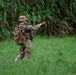 A team leader from 2nd Battalion, 23rd Infantry Regiment signals to his team during movement across open terrain at the Story Live Fire Complex, South Korea, July 31, 2025.