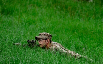 A Soldier with 2nd Battalion, 23rd Infantry Regiment establishes a support-by-fire position during a squad live-fire exercise at the Story Live Fire Complex, South Korea, July 31, 2025.