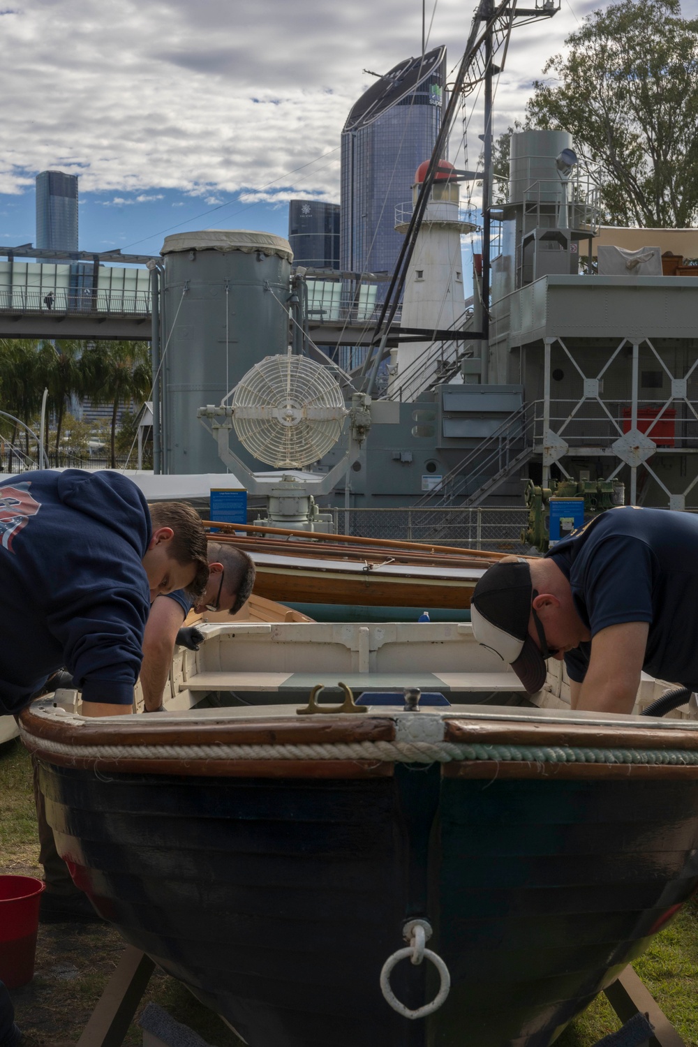 USS Frank Cable (AS 40) and USS Ohio (SSGN 726) Sailors participate in a COMREL at Queensland Maritime Museum