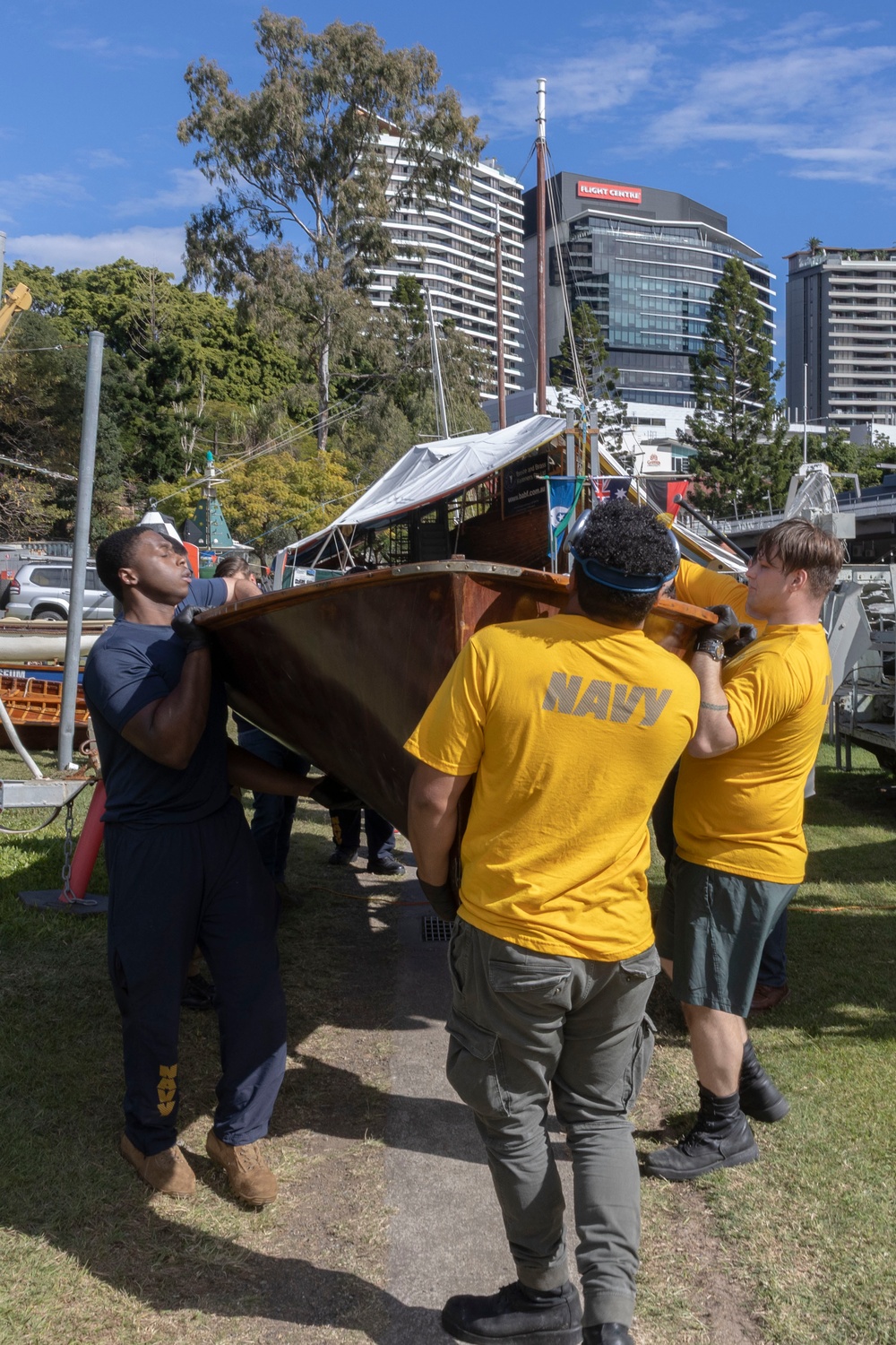 USS Frank Cable (AS 40) and USS Ohio (SSGN 726) Sailors participate in a COMREL at Queensland Maritime Museum