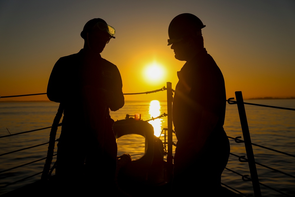 BMSA Dewan Henry and BM3 Collin Garey set a mooring line on the foc'sle