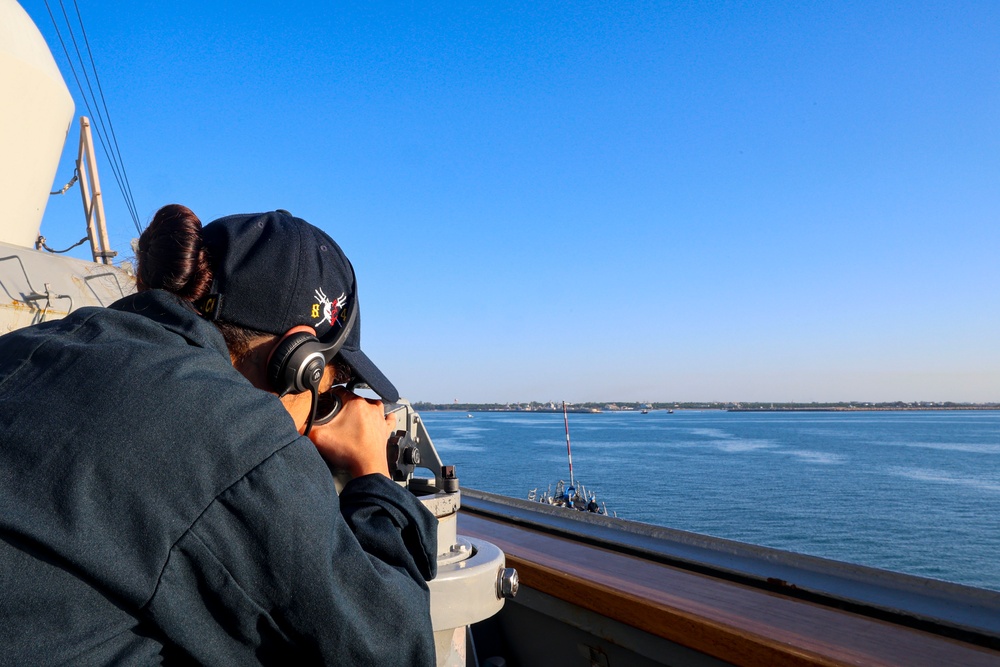 QMSN Ashley Francoirizarry uses an alidade to verify baring and range at sea