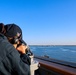 QMSN Ashley Francoirizarry uses an alidade to verify baring and range at sea