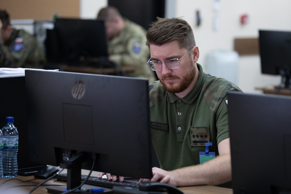Polish Soldier Supports Higher Control Cell During Command Post Exercise