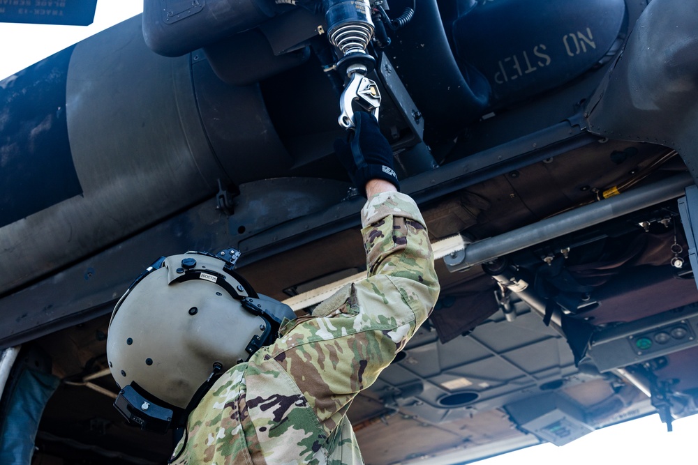 Pre-flight checks by a U.S. Army MH-60 Blackhawk crew