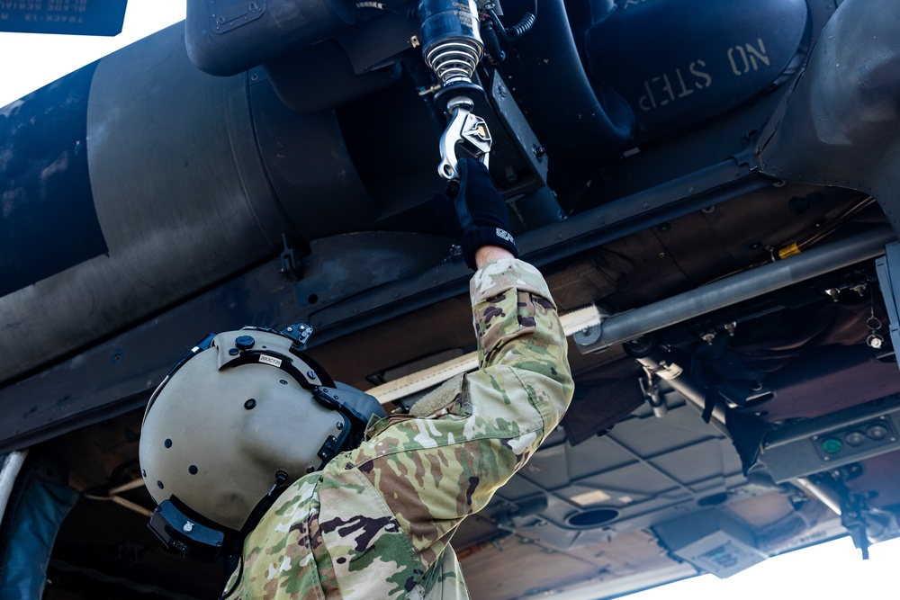 Pre-flight checks by a U.S. Army MH-60 Blackhawk crew