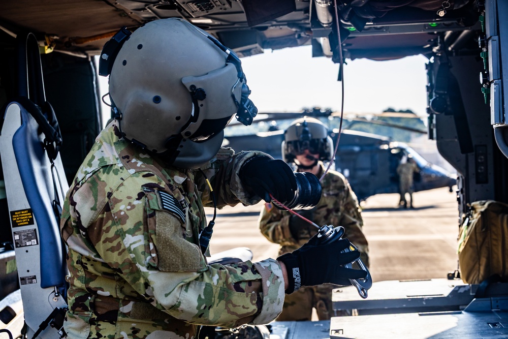 Pre-flight checks by a U.S. Army MH-60 Blackhawk crew
