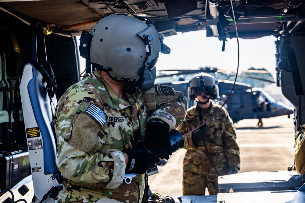 Pre-flight checks by a U.S. Army MH-60 Blackhawk crew