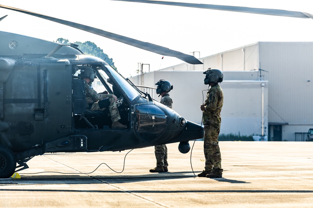 Pre-flight checks by a U.S. Army MH-60 Blackhawk crew
