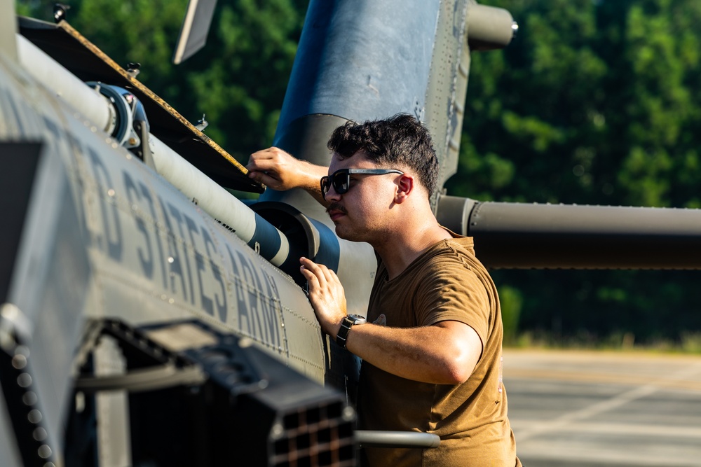 Pre-flight checks by a U.S. Army MH-60 Blackhawk crew