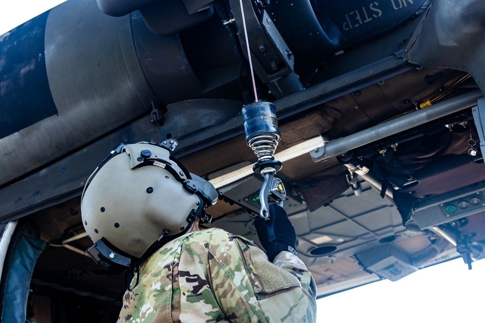 Pre-flight checks by a U.S. Army MH-60 Blackhawk crew