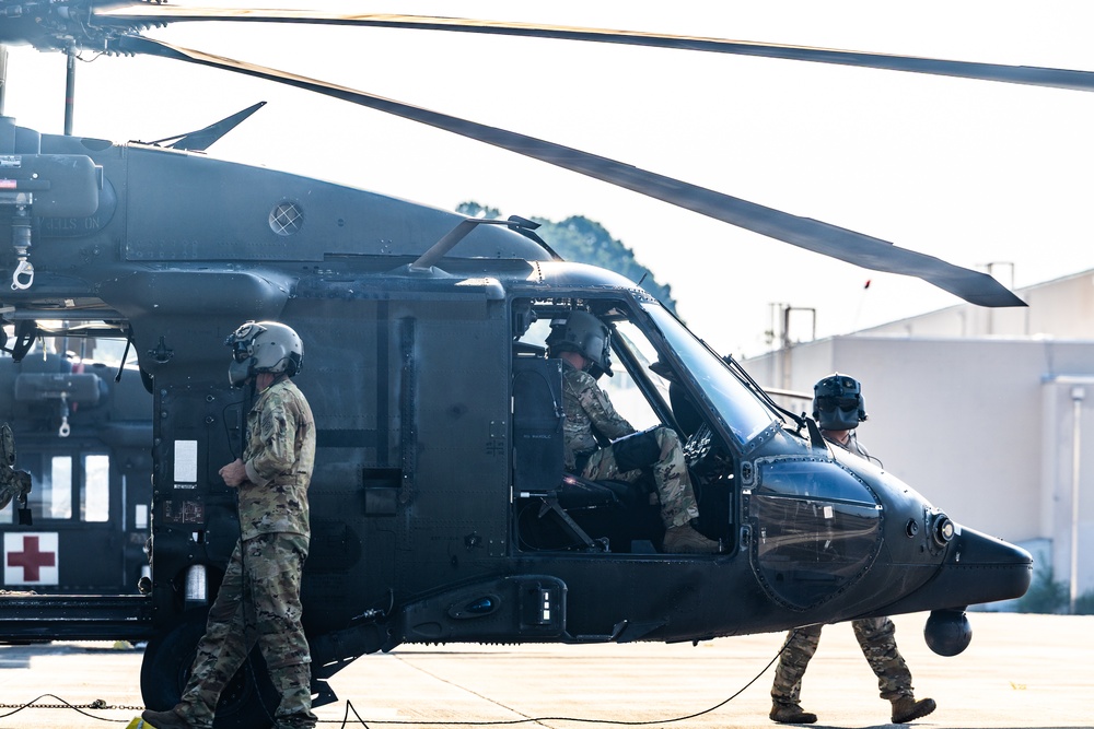 Pre-flight checks by a U.S. Army MH-60 Blackhawk crew