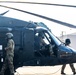 Pre-flight checks by a U.S. Army MH-60 Blackhawk crew
