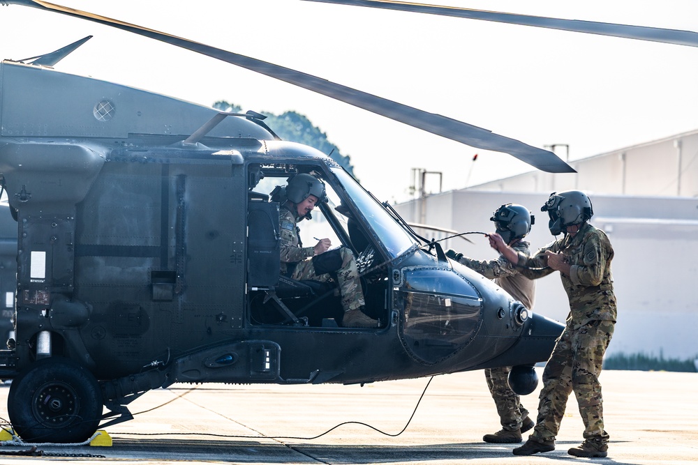 Pre-flight checks by a U.S. Army MH-60 Blackhawk crew