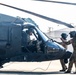 Pre-flight checks by a U.S. Army MH-60 Blackhawk crew