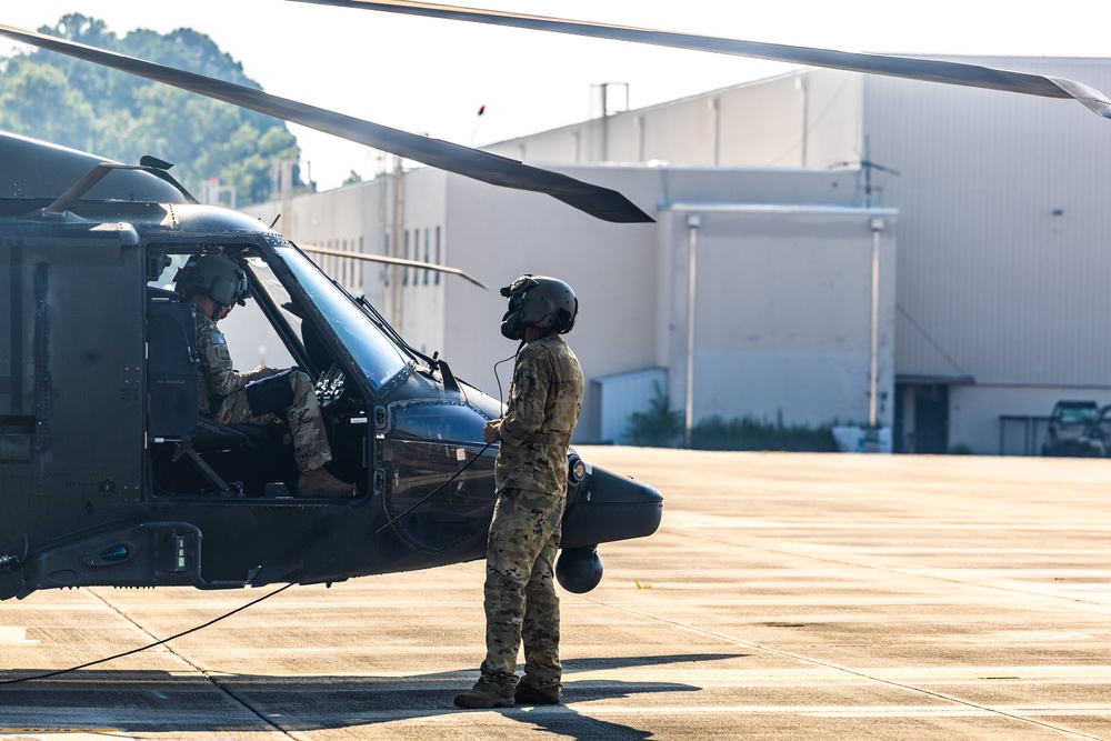 Pre-flight checks by a U.S. Army MH-60 Blackhawk crew