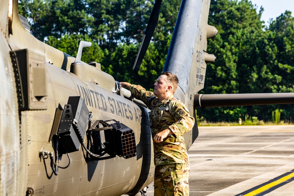 Pre-flight checks by a U.S. Army MH-60 Blackhawk crew