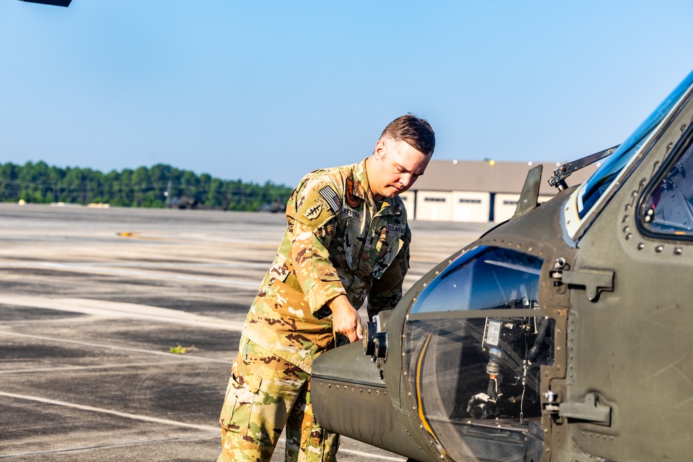 Pre-flight checks by a U.S. Army MH-60 Blackhawk crew