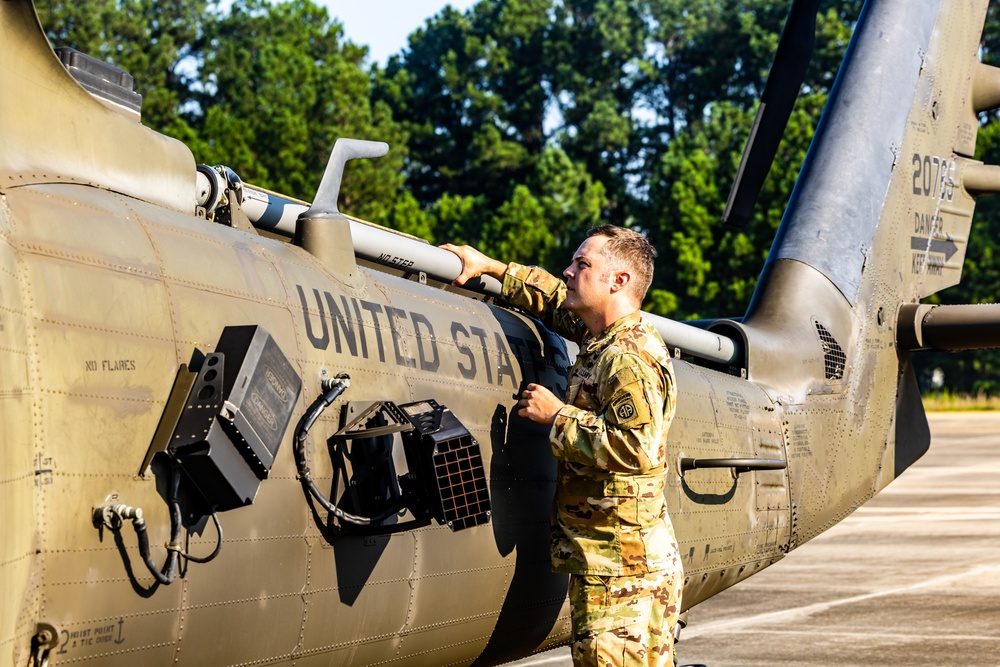 Pre-flight checks by a U.S. Army MH-60 Blackhawk crew