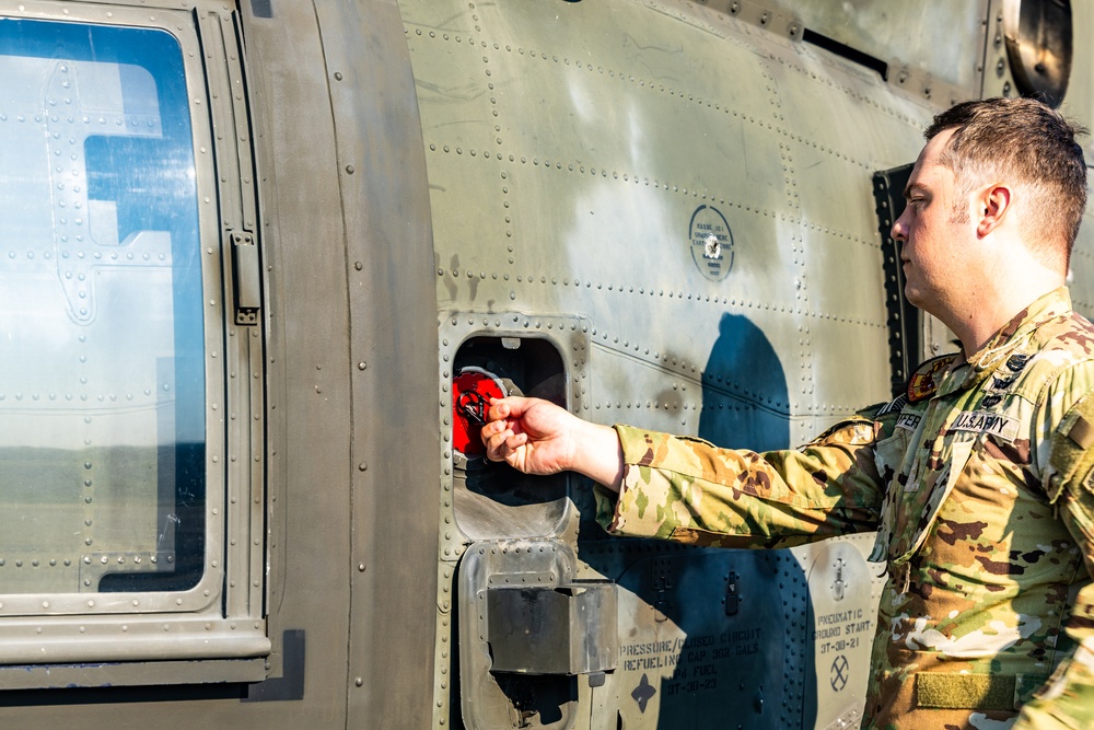 Pre-flight checks by a U.S. Army MH-60 Blackhawk crew