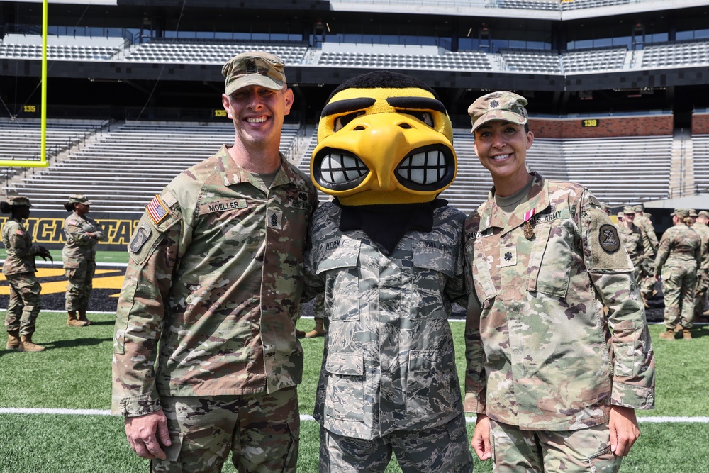 109th MMB leadership poses with Herky during change of command ceremony