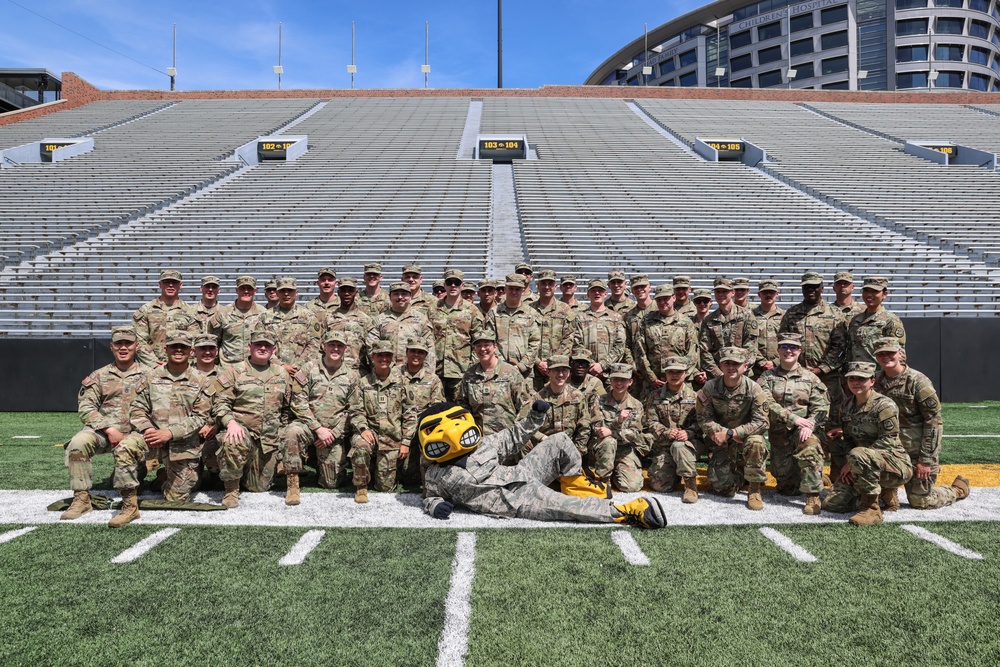 Herky the Hawk poses with 109th MMB Soldiers at Kinnick Stadium
