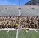 Herky the Hawk poses with 109th MMB Soldiers at Kinnick Stadium