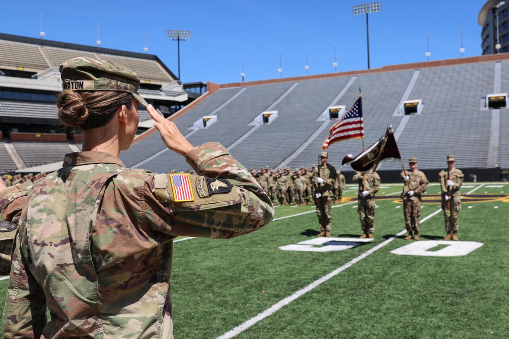 Outgoing 109th MMB commander salutes during colors presentation