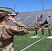 Outgoing 109th MMB commander salutes during colors presentation