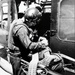 Upscale image of Seawolf HA(L)-3 Gunship U.S. Navy crewman reloads M60 machine gun of a HA(L)-3 UH-1B aboard USS Harnett County (LST821), Vietnam, 10 September 1969 (K-58290)