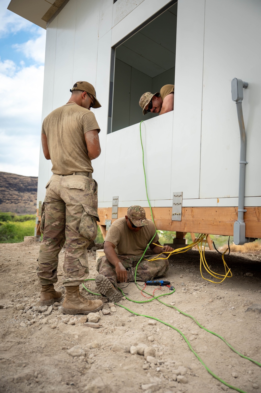 Airmen Wire a Newly Built House
