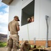 Airmen Wire a Newly Built House
