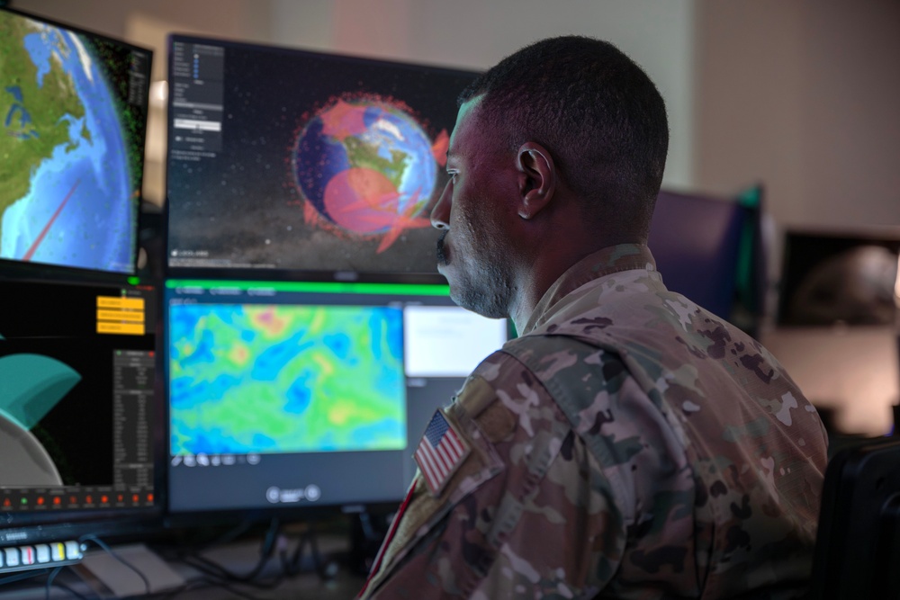 Combined Space Operations Center (CSpOC) staff monitor workstations.