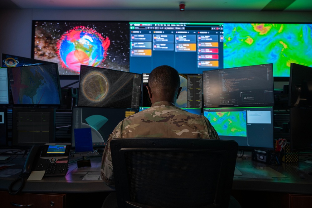 Combined Space Operations Center (CSpOC) staff monitor workstations.