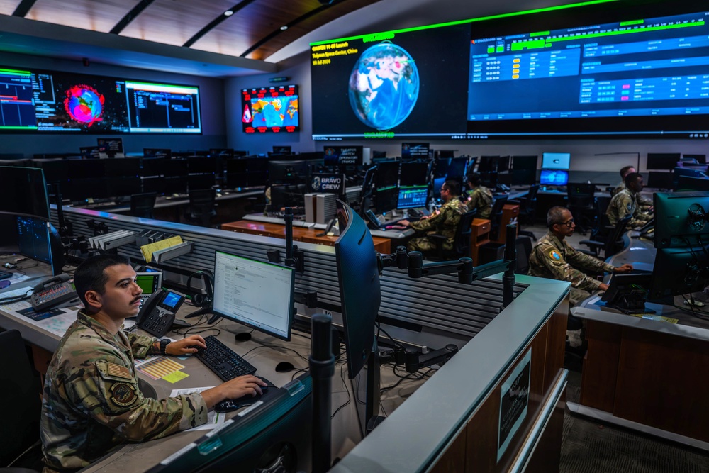 Combined Space Operations Center (CSpOC) staff monitor workstations.